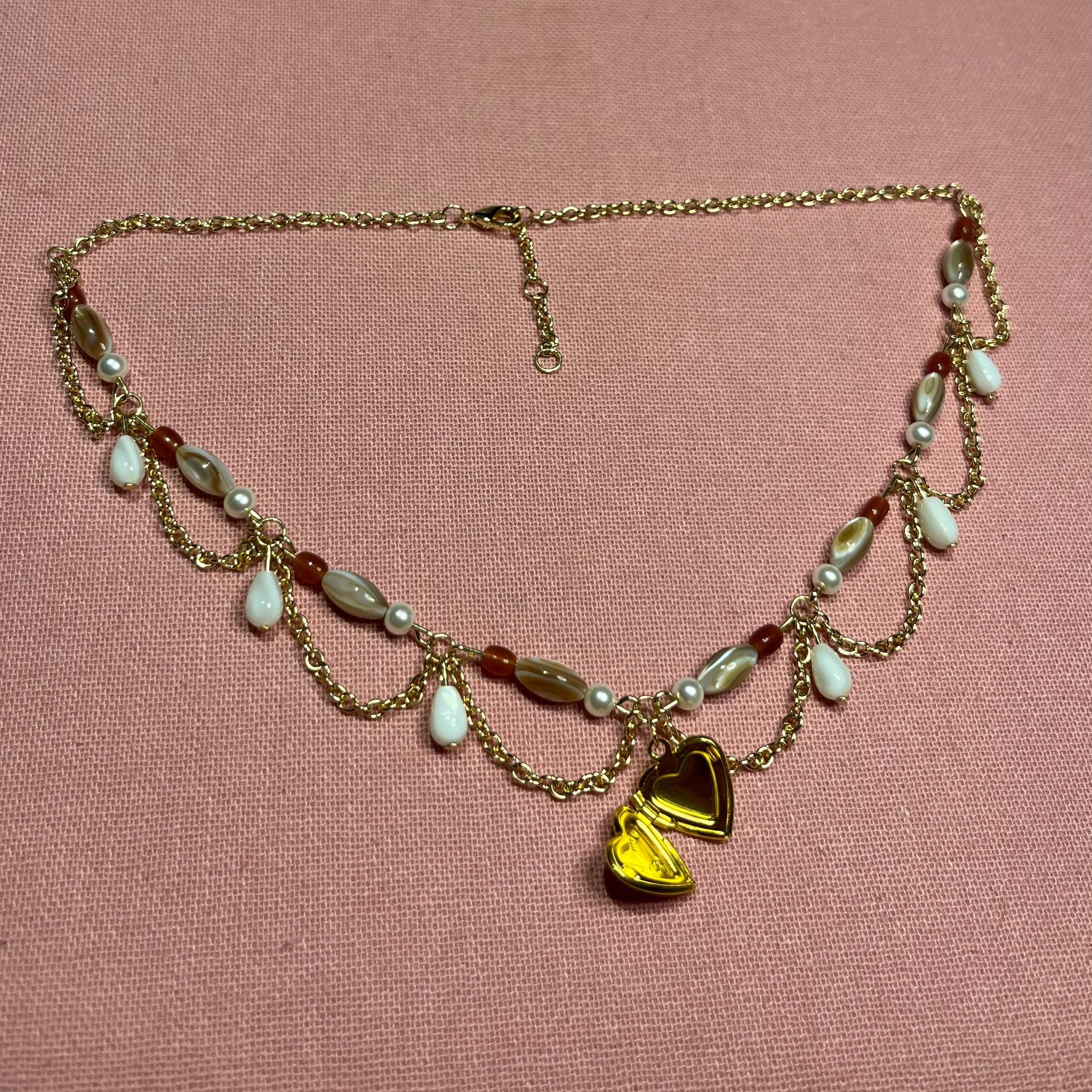 Darling Dynasty: Gold Heart Locket Necklace with Gold Chain and White/Amber Beading