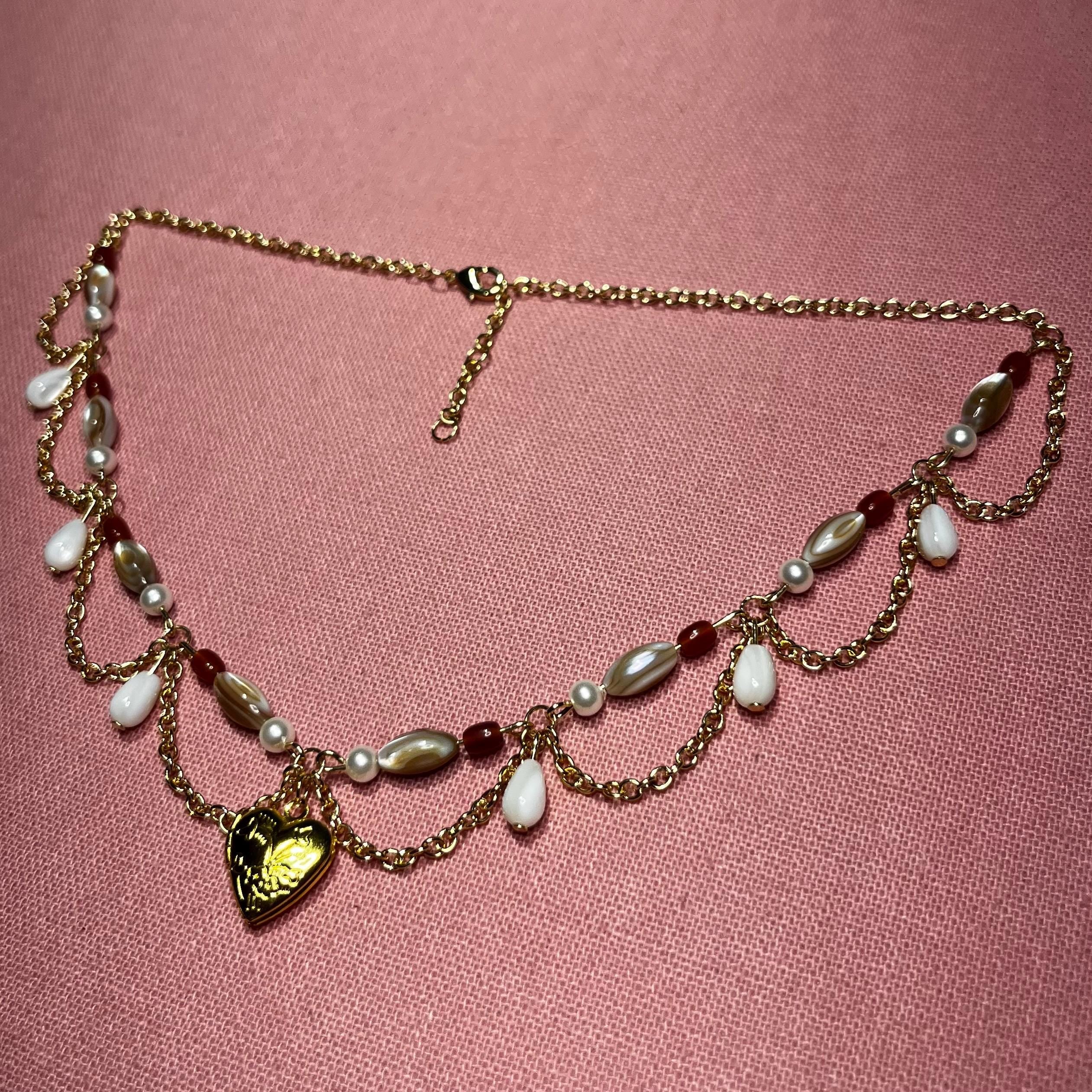 Darling Dynasty: Gold Heart Locket Necklace with Gold Chain and White/Amber Beading
