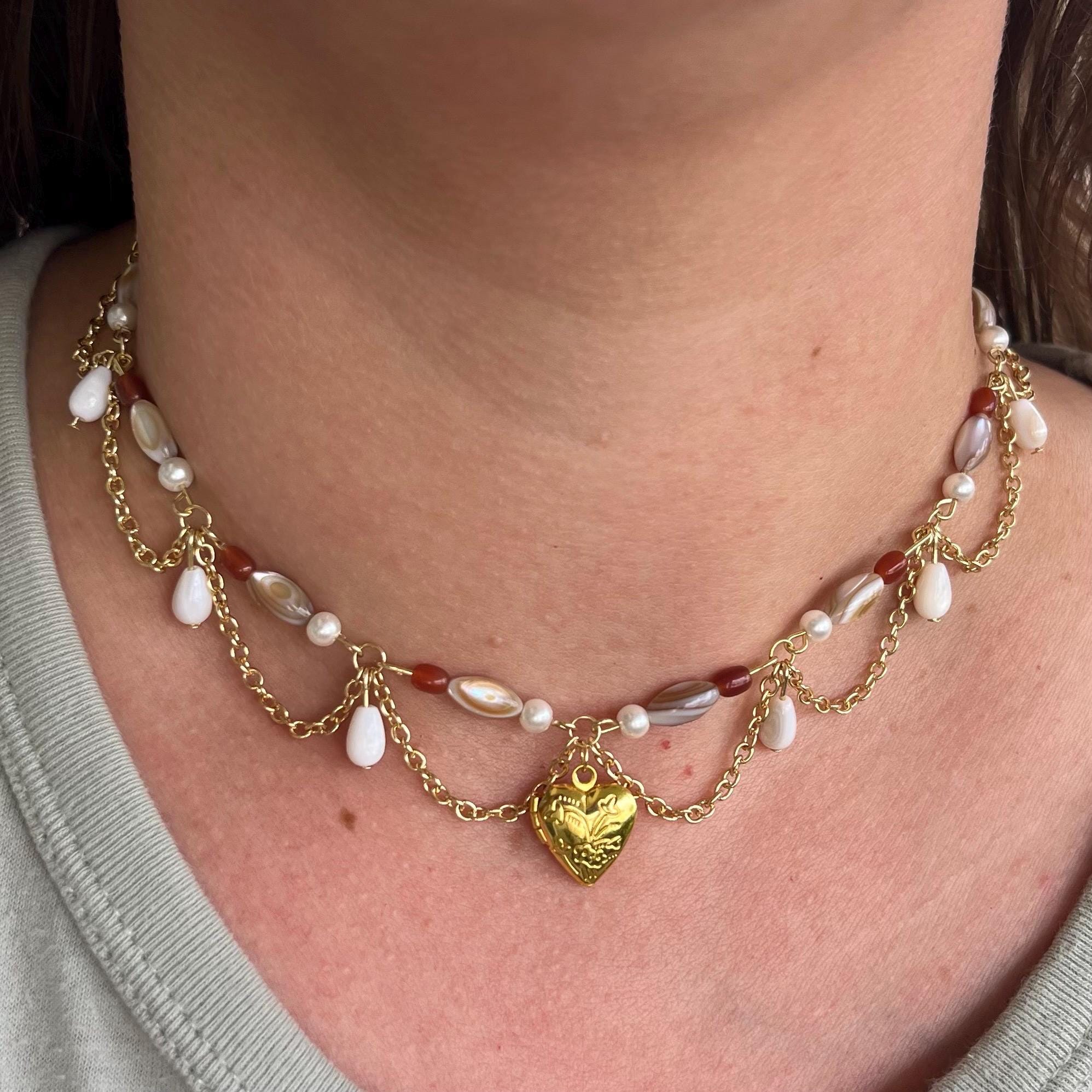Darling Dynasty: Gold Heart Locket Necklace with Gold Chain and White/Amber Beading